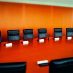 conference-room-orange-wall-GettyImages-595776771-1300w-867h