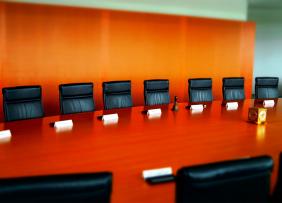 conference-room-orange-wall-GettyImages-595776771-1300w-867h