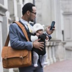 businessman-with-briefcase-bag-phone-and-baby-GettyImages-722208811-1300w-867h