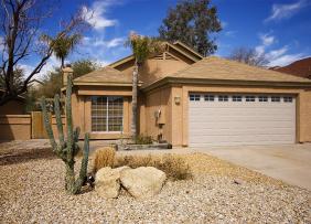 southwestern-home-with-cactus-and-blue-sky-flipped-GettyImages-184322729-1300w-867h