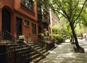 brownstones-tree-lined-street-GettyImages-500753331-1300w-867h
