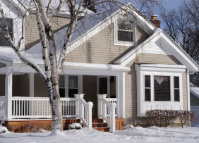 midwest-suburban-house-in-snow-getty-185077515-1300w-867h