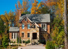 brick-house-in-autumn-GettyImages-472069091-1300w-867h